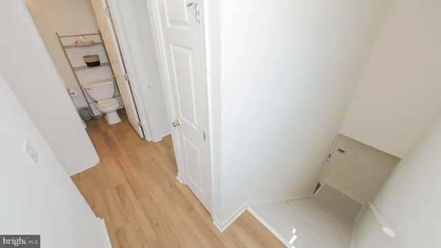 a view of a hallway with closet