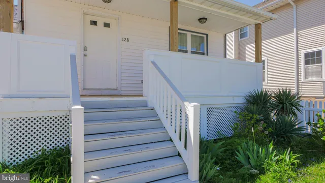 a view of balcony with wooden floor and stairs