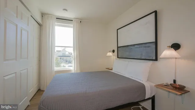 a room with a wooden floor and a window