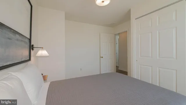 a view of a room with wooden floor and windows