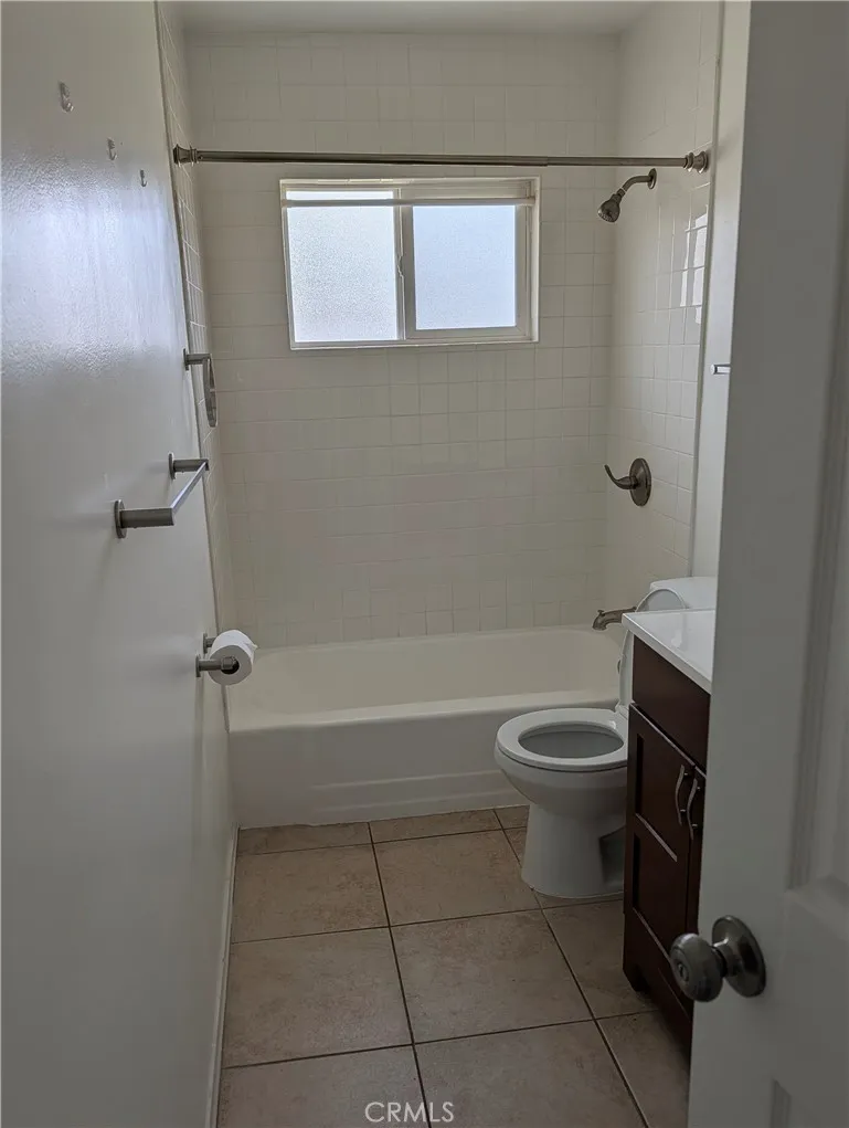 8641 Garfield Street, Unit 1 Riverside, CA 92504 - Photo 11 of 19 a bathroom with a toilet a sink and a shower