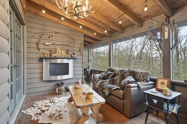 a outdoor living space with furniture and a fireplace