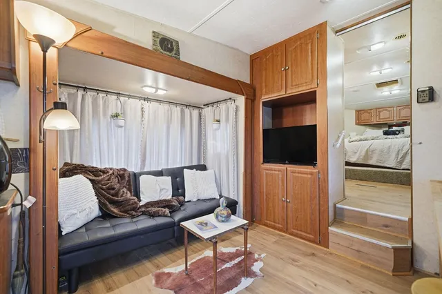 a bathroom with a sink a mirror and a shower