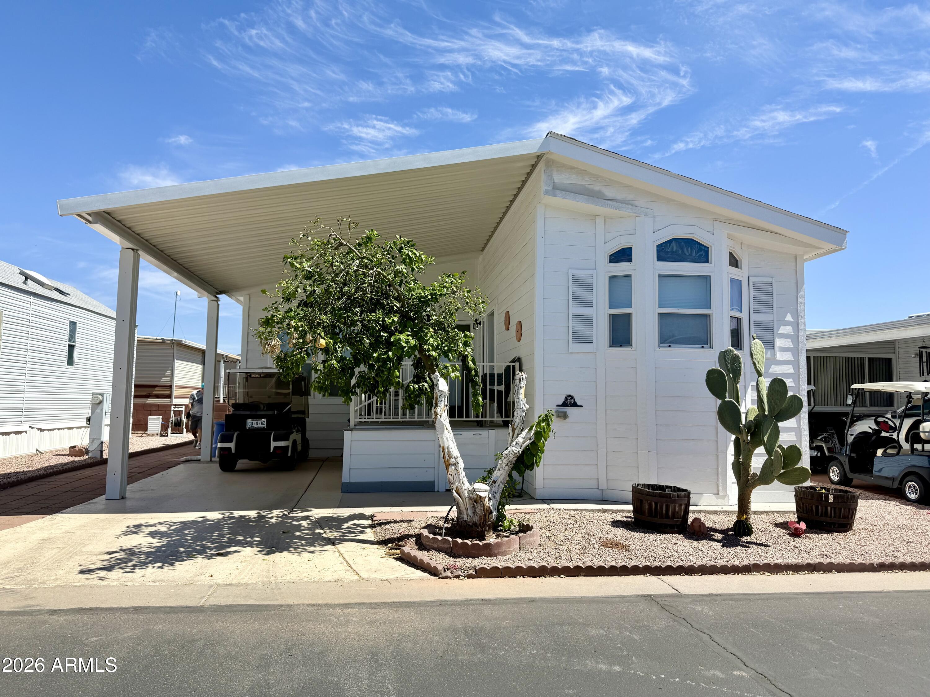 7750 East Broadway Road, Unit 197 Mesa, AZ 85208 - Photo 1 of 38 a view of a house with a patio