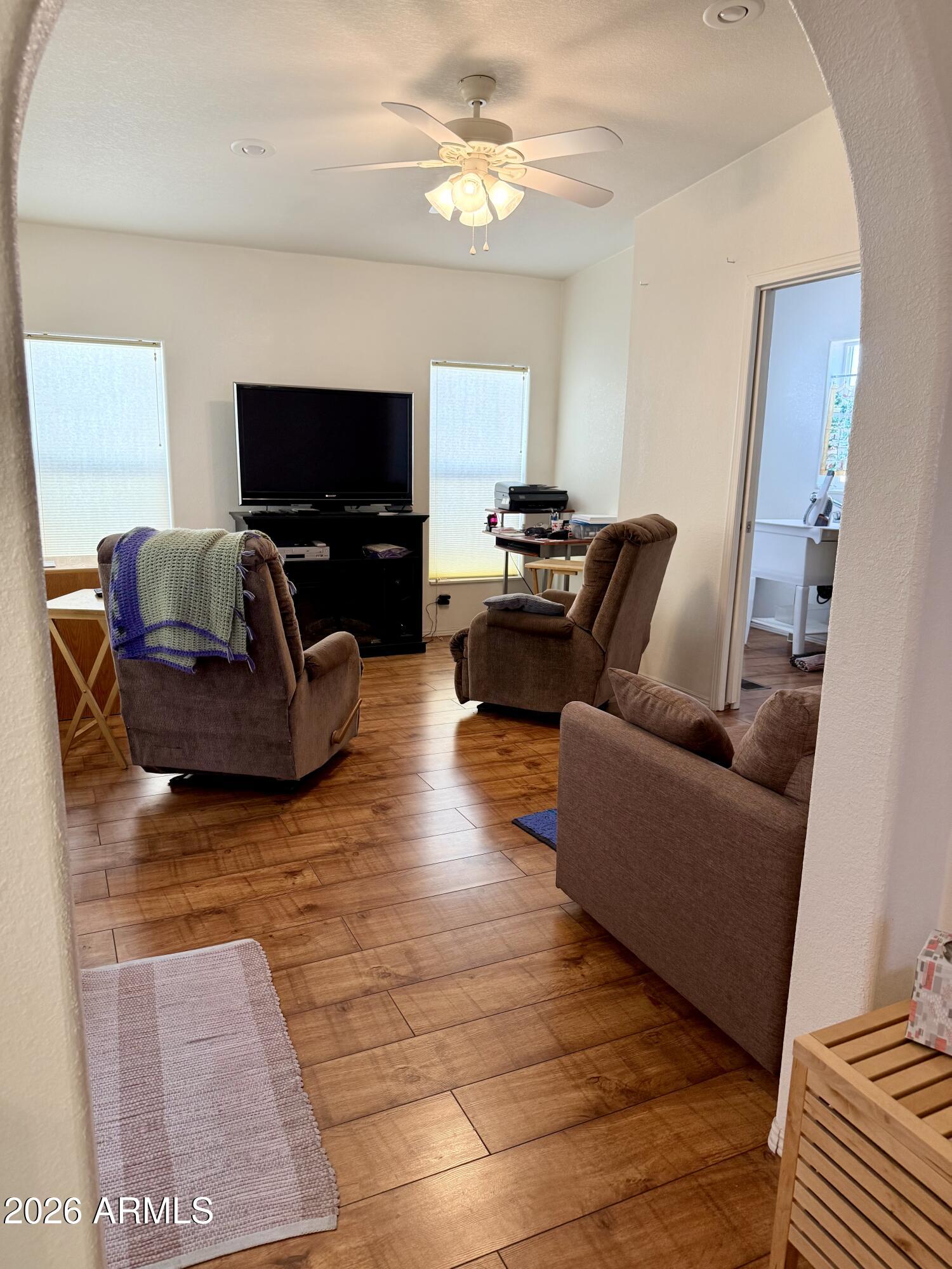 7750 East Broadway Road, Unit 197 Mesa, AZ 85208 - Photo 14 of 38 a living room with furniture and a flat screen tv