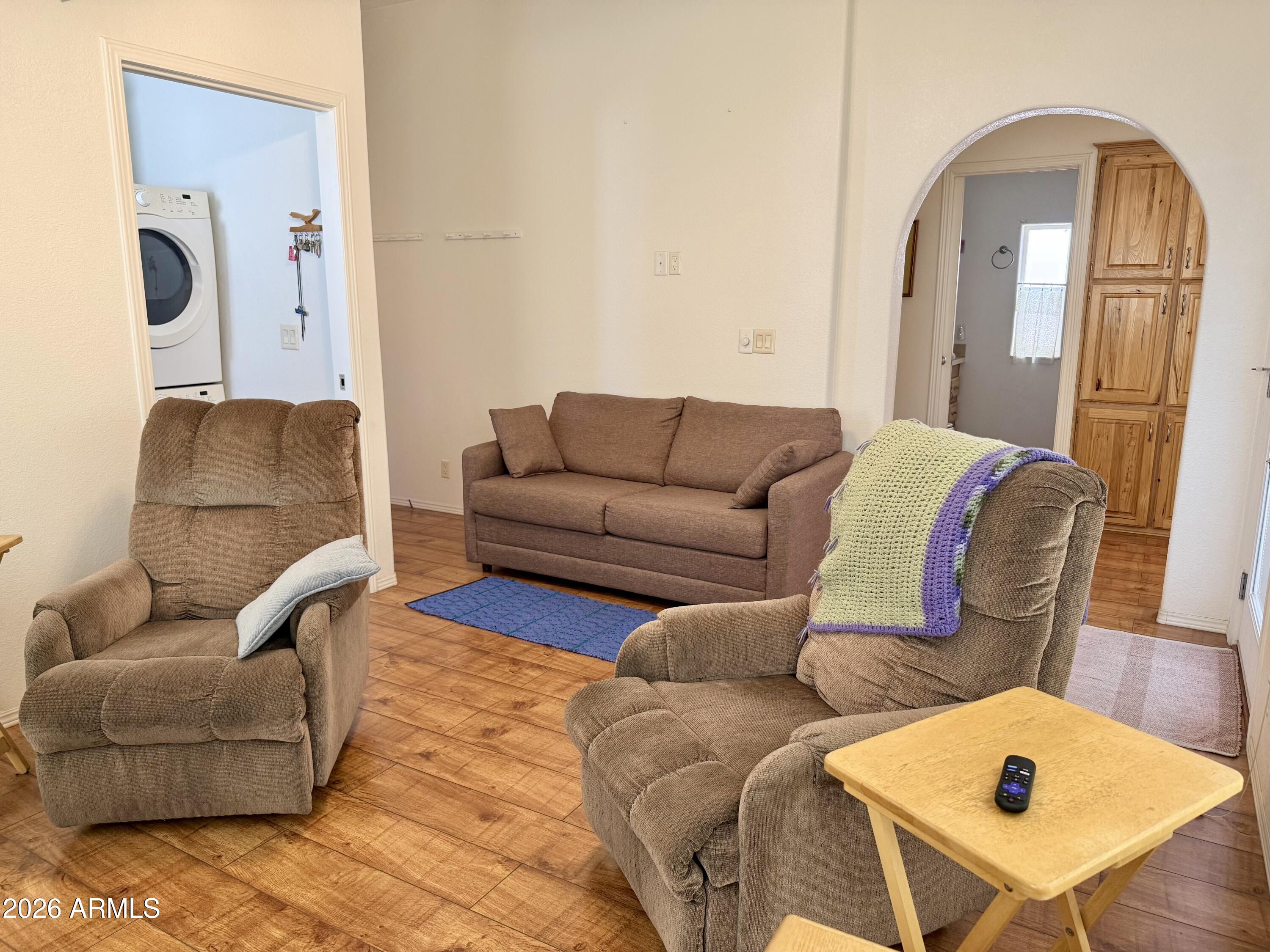 7750 East Broadway Road, Unit 197 Mesa, AZ 85208 - Photo 15 of 38 a living room with furniture and a mirror