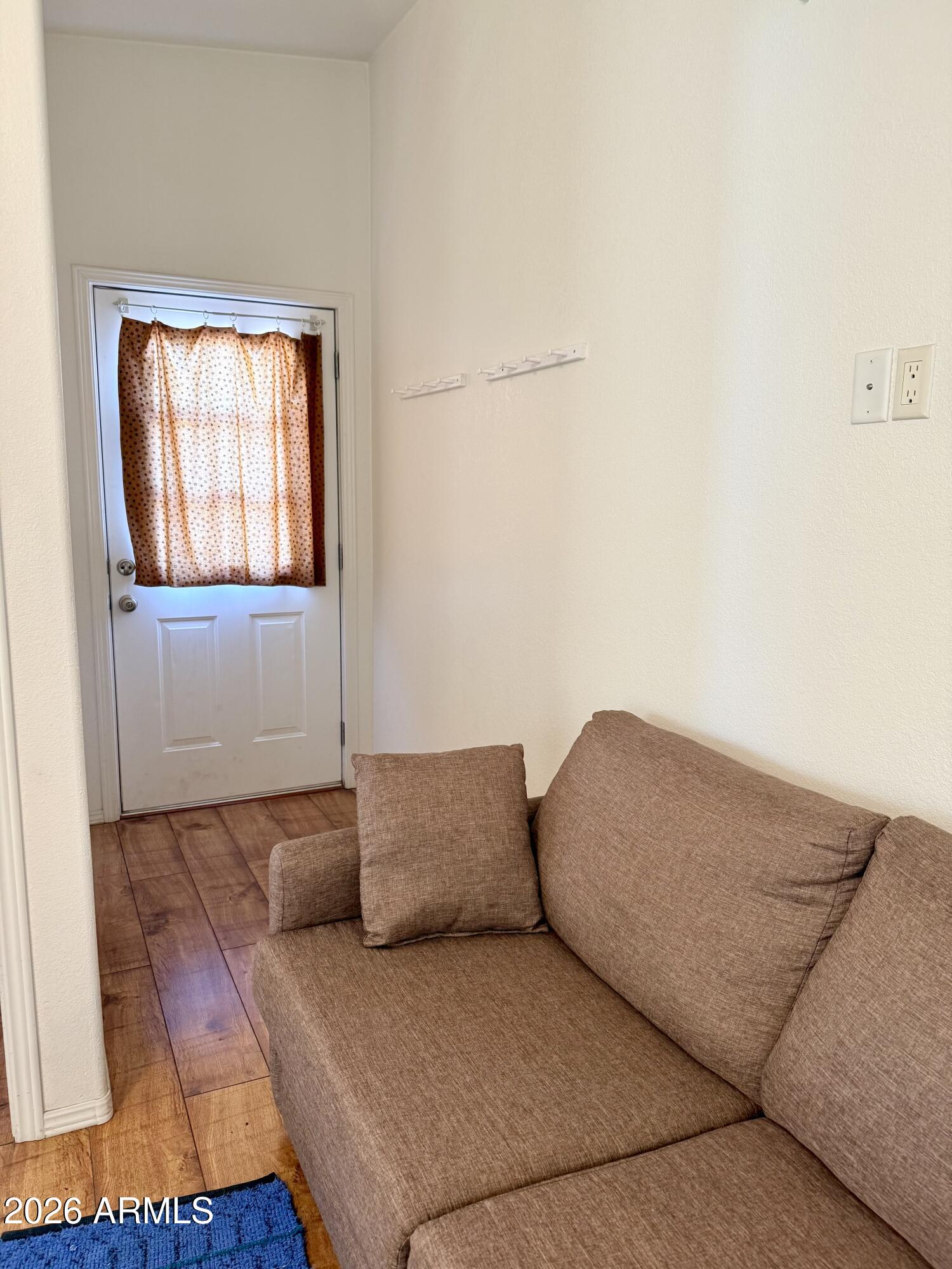 7750 East Broadway Road, Unit 197 Mesa, AZ 85208 - Photo 17 of 38 a living room with furniture and a window