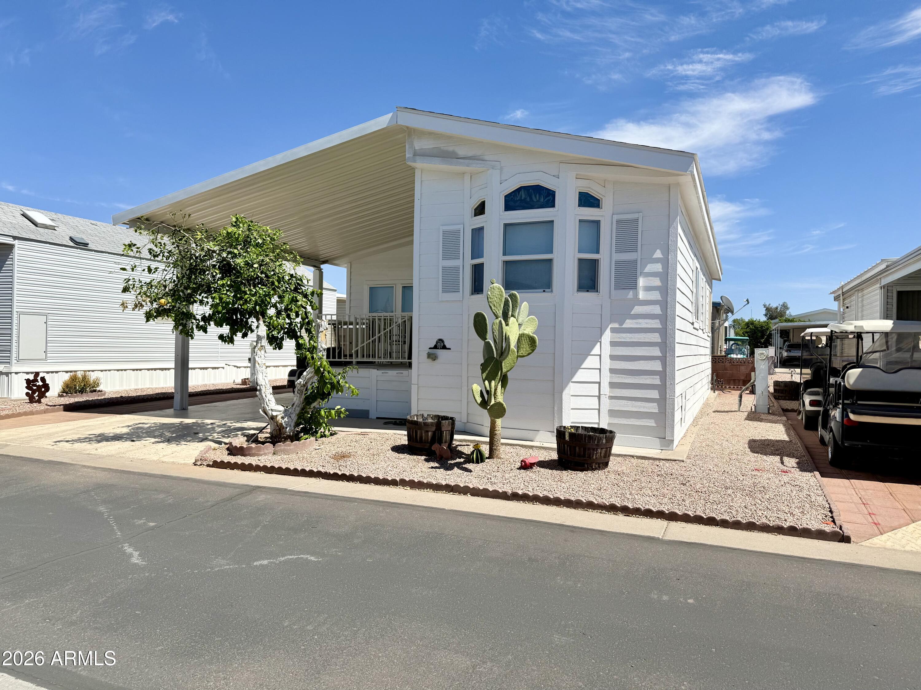 7750 East Broadway Road, Unit 197 Mesa, AZ 85208 - Photo 24 of 38 a front view of a house with a view