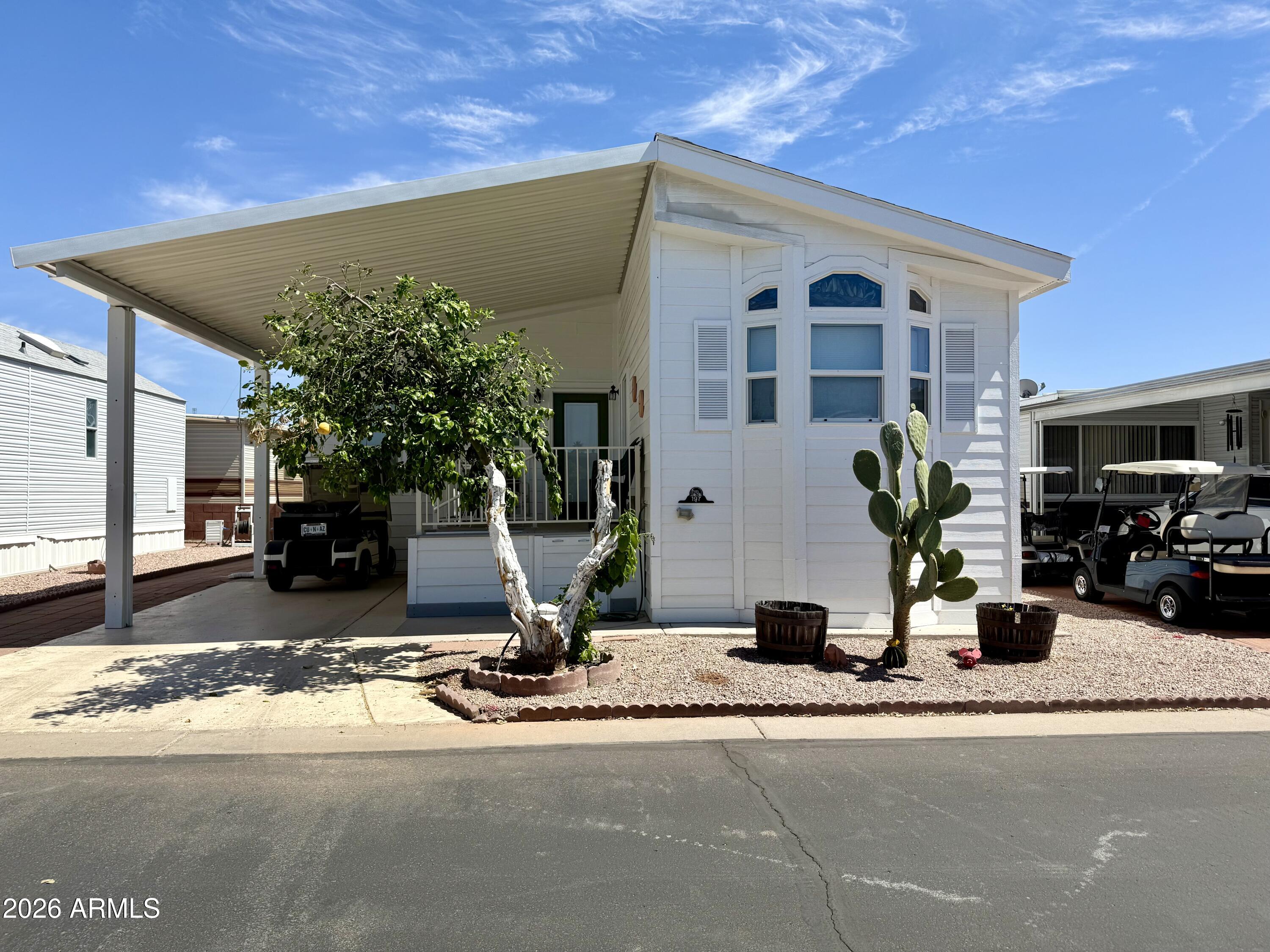 7750 East Broadway Road, Unit 197 Mesa, AZ 85208 - Photo 26 of 38 a view of a building with a patio