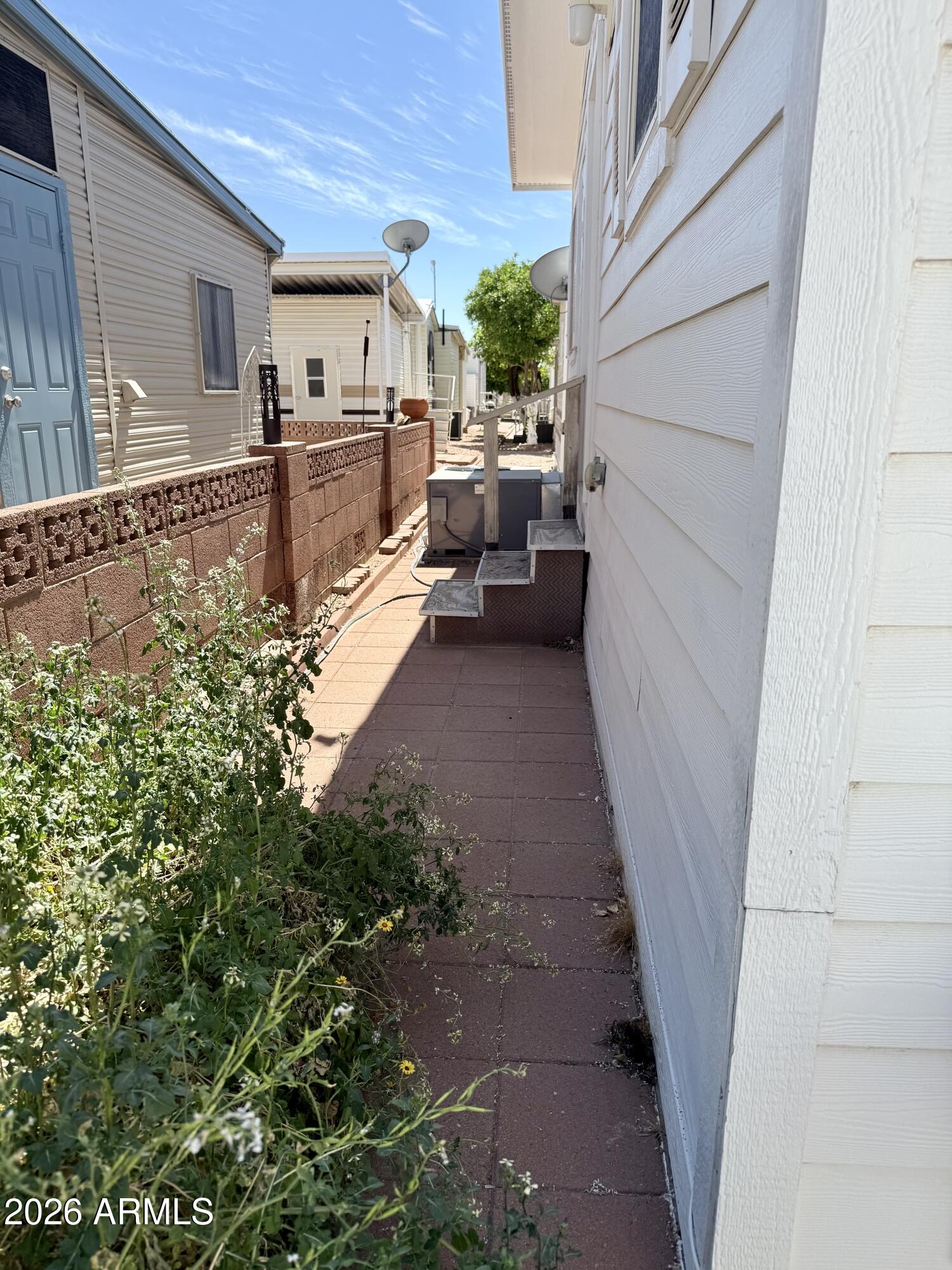 7750 East Broadway Road, Unit 197 Mesa, AZ 85208 - Photo 28 of 38 a view of a back yard of the house