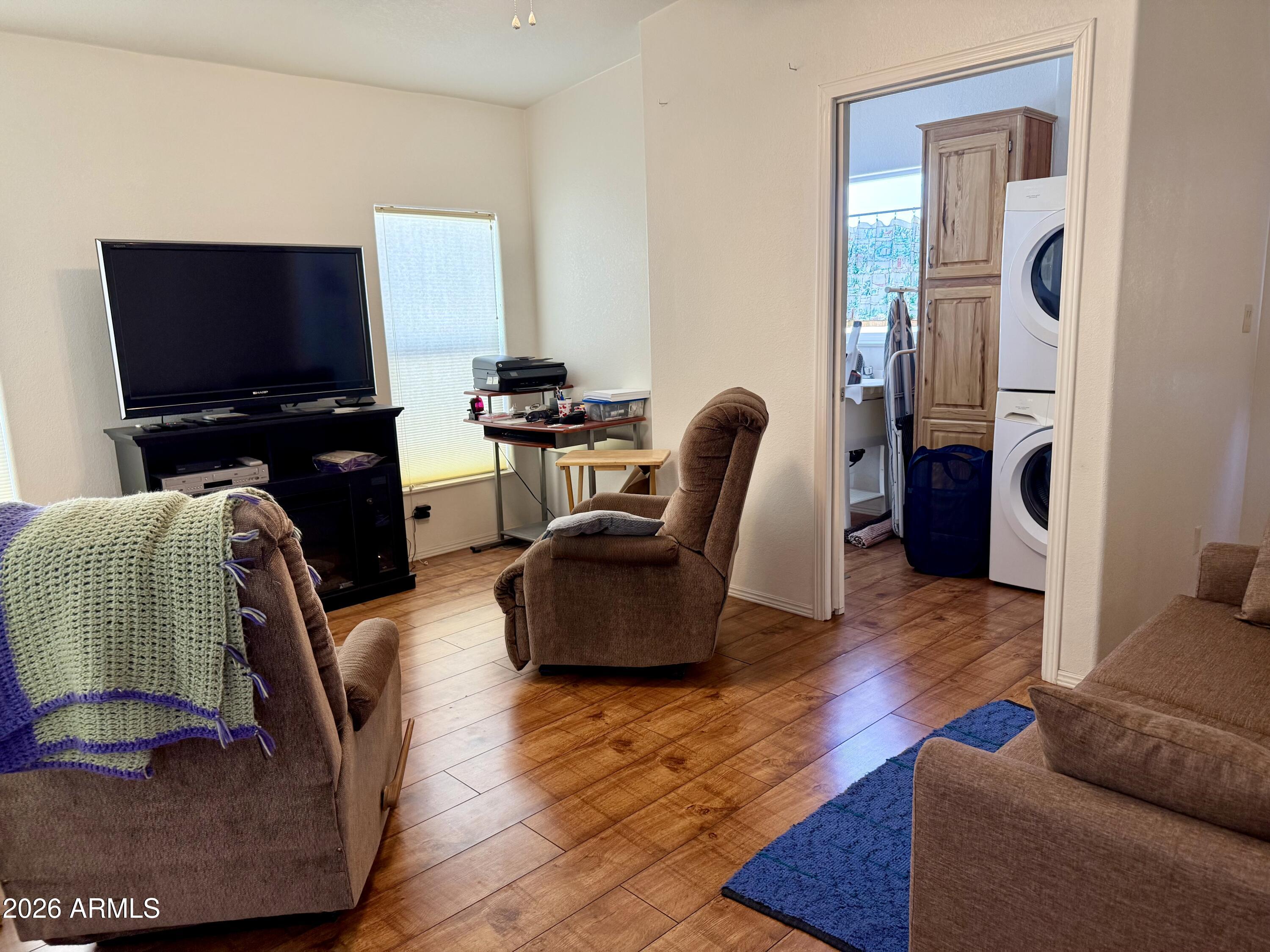 7750 East Broadway Road, Unit 197 Mesa, AZ 85208 - Photo 4 of 38 a living room with furniture and a flat screen tv