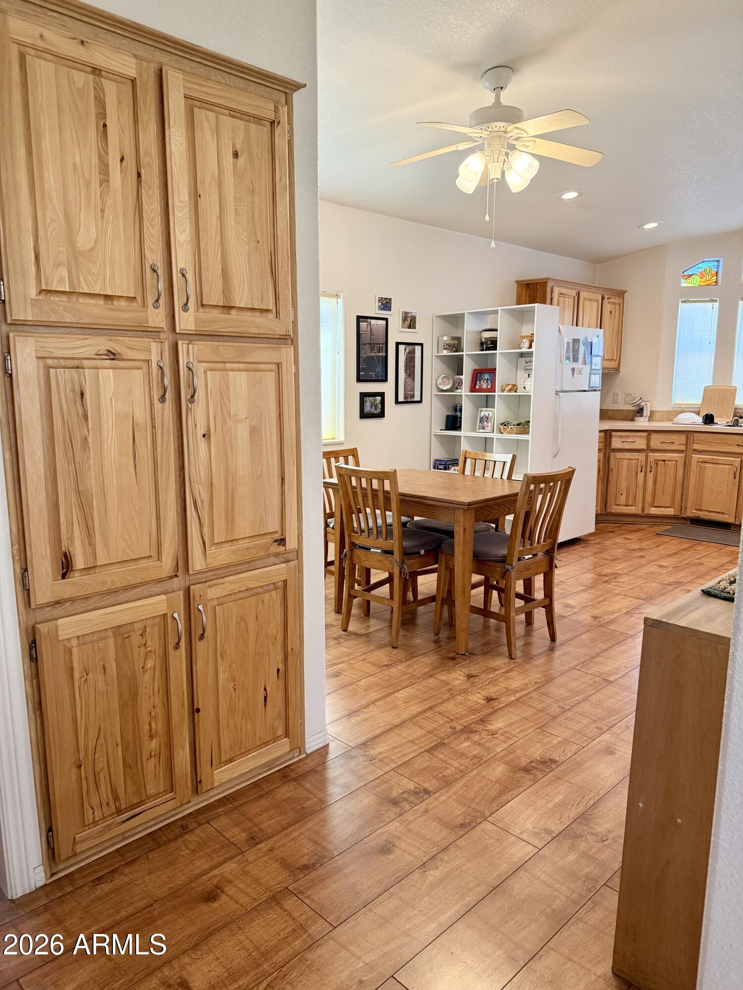 7750 East Broadway Road, Unit 197 Mesa, AZ 85208 - Photo 5 of 38 a view of a dining room with furniture window and wooden floor