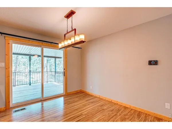 a view of outdoor space with wooden floor