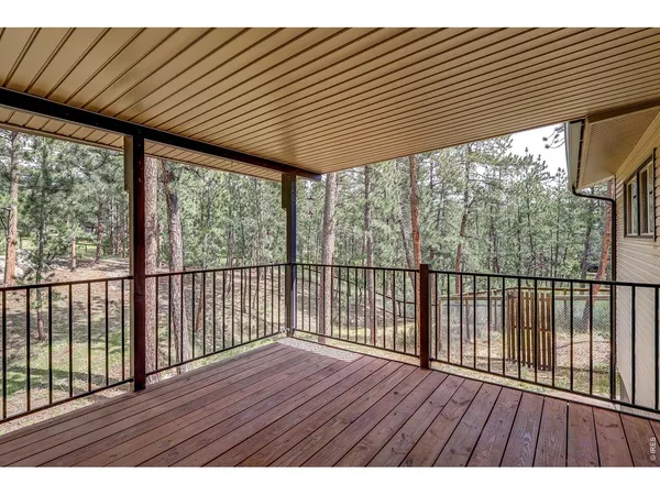 a open kitchen with kitchen island granite countertop a sink and refrigerator