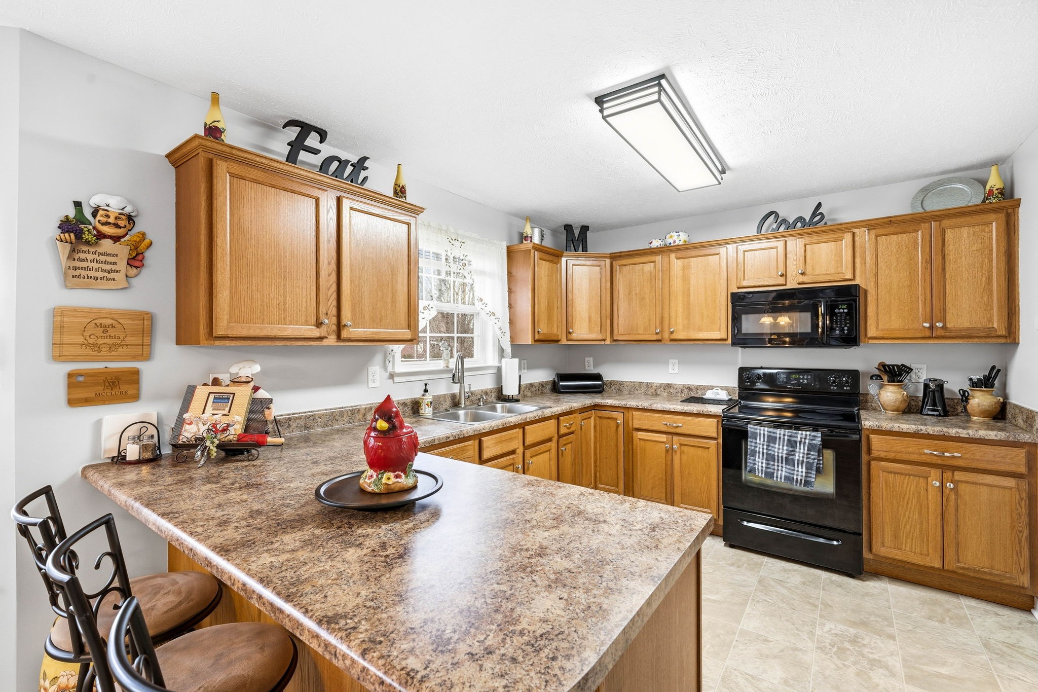 1931 Mural Lane Murfreesboro, TN 37127 - Photo 8 of 47 a kitchen with stainless steel appliances granite countertop a sink dishwasher and cabinets with wooden floor