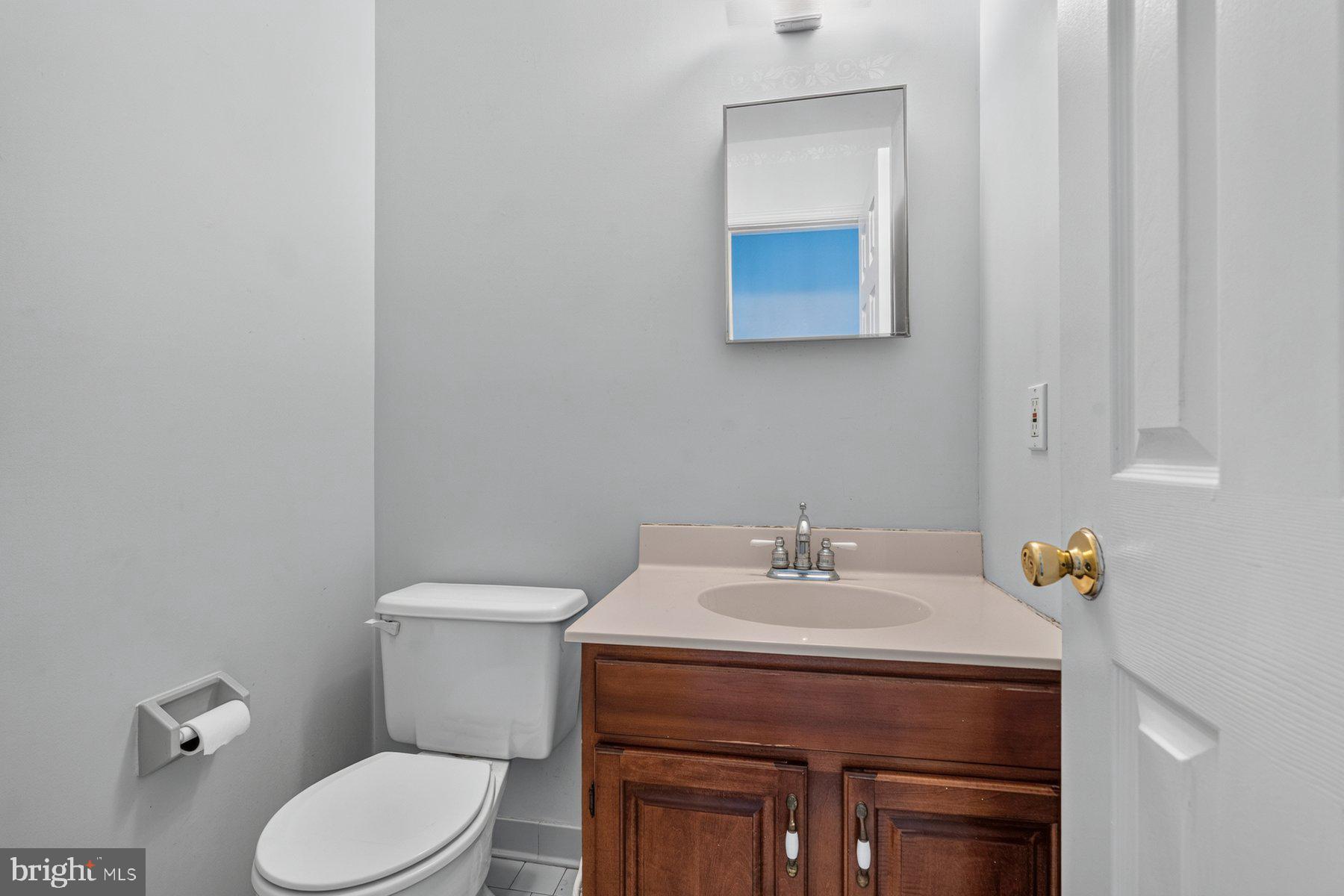 49 Rockland Road Westminster, MD 21158 - Photo 43 of 66 a bathroom with a sink a toilet and mirror