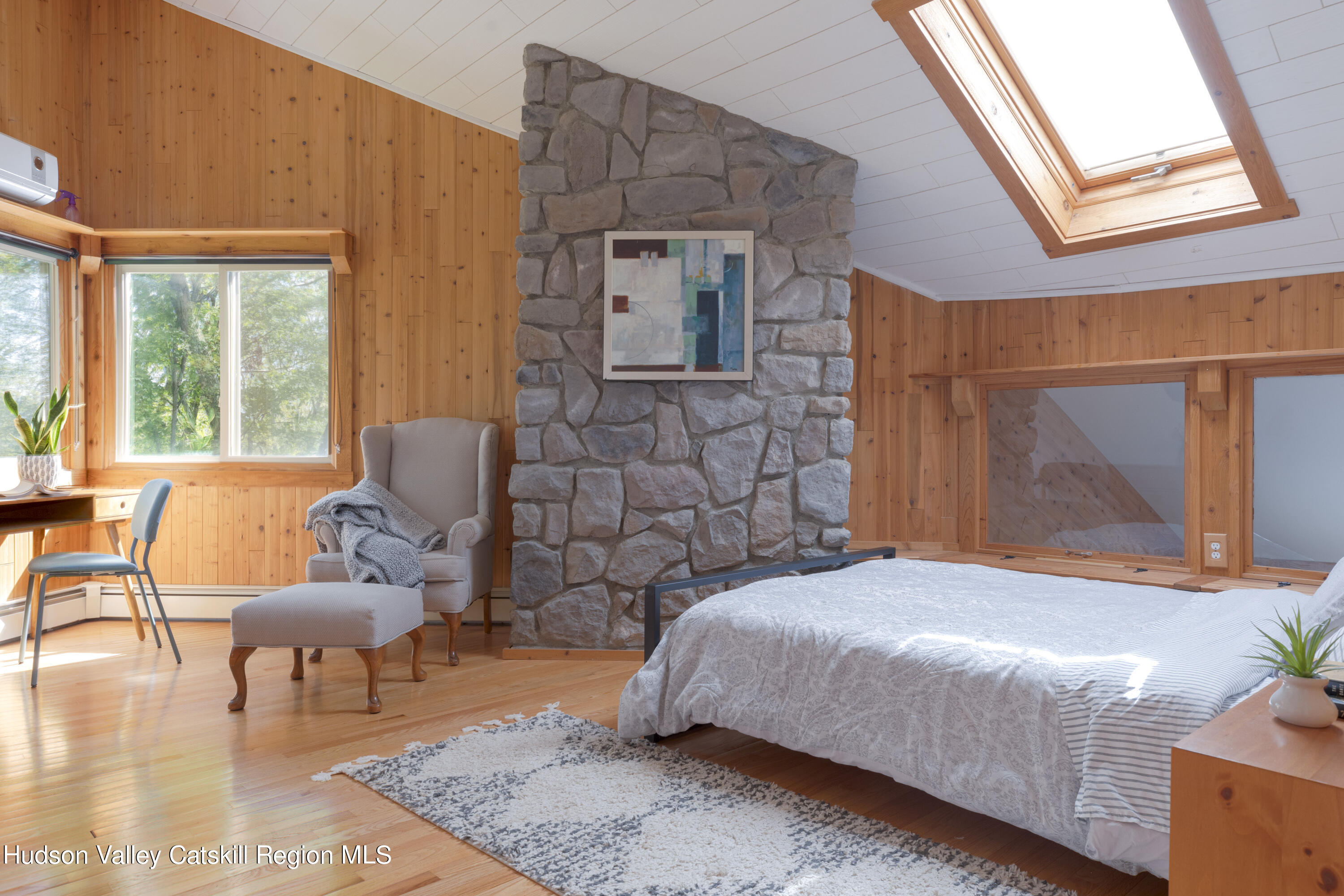 94 Sparkling Ridge Road New Paltz, NY 12561 - Photo 18 of 35 a bedroom with a bed and wooden floor