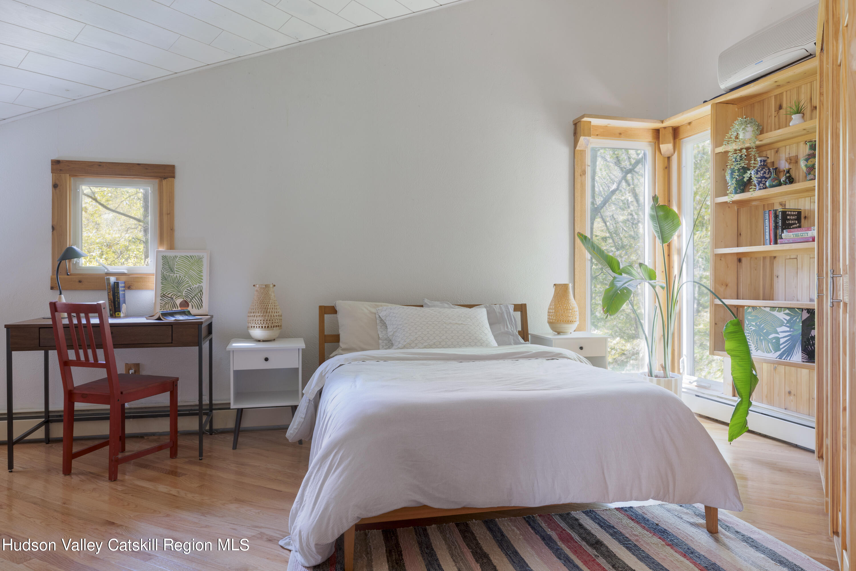 94 Sparkling Ridge Road New Paltz, NY 12561 - Photo 20 of 35 a bedroom with a bed and a table