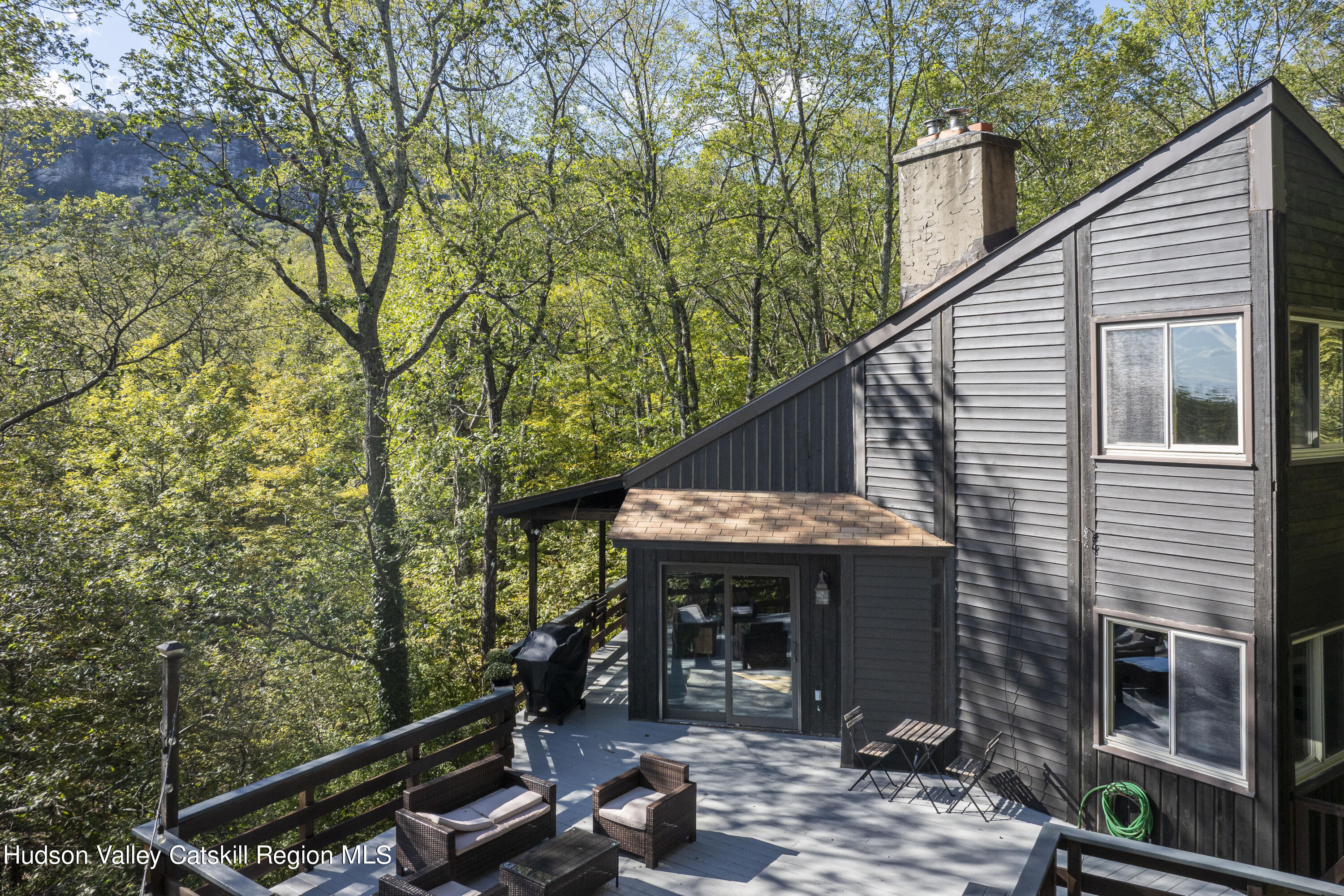 94 Sparkling Ridge Road New Paltz, NY 12561 - Photo 2 of 35 a view of a house with backyard porch and sitting area