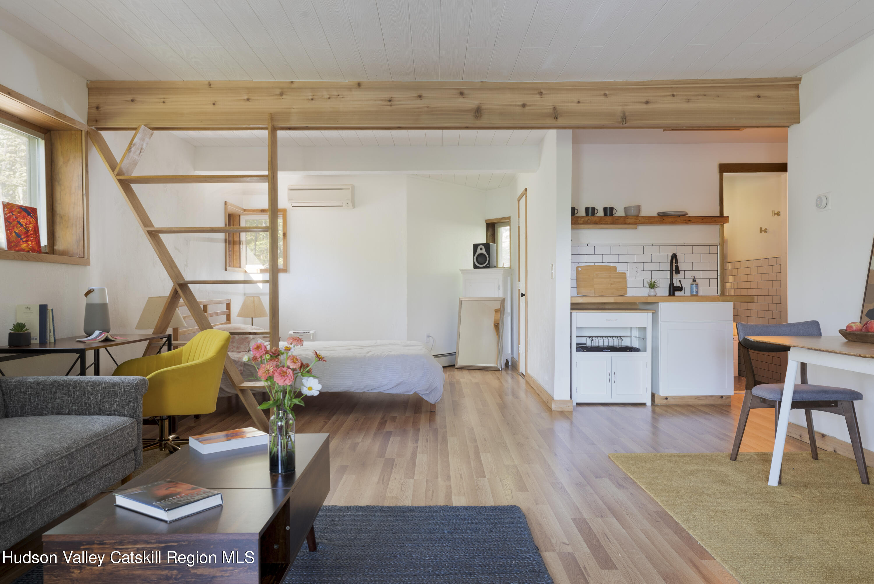 94 Sparkling Ridge Road New Paltz, NY 12561 - Photo 27 of 35 a living room with furniture and a floor to ceiling window