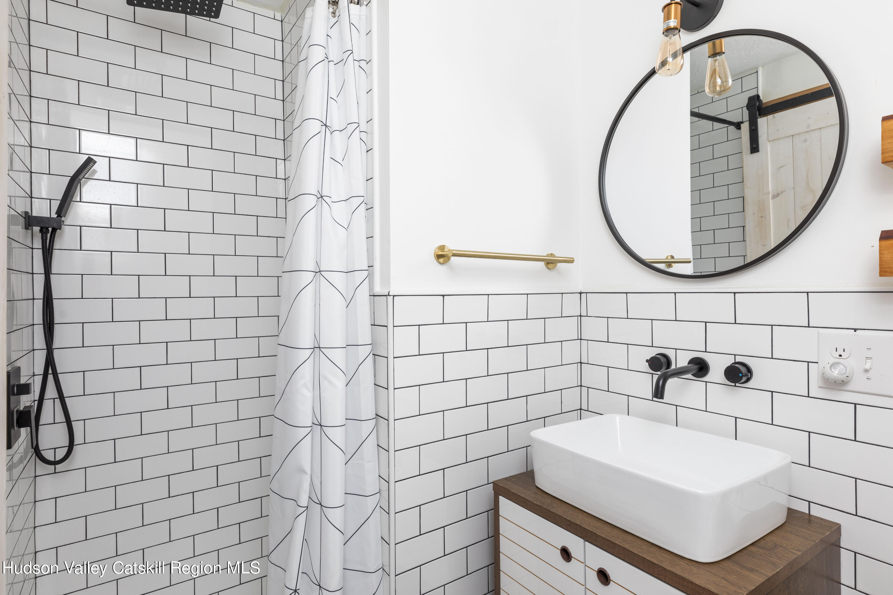 94 Sparkling Ridge Road New Paltz, NY 12561 - Photo 28 of 35 a bathroom with a sink a toilet and a mirror