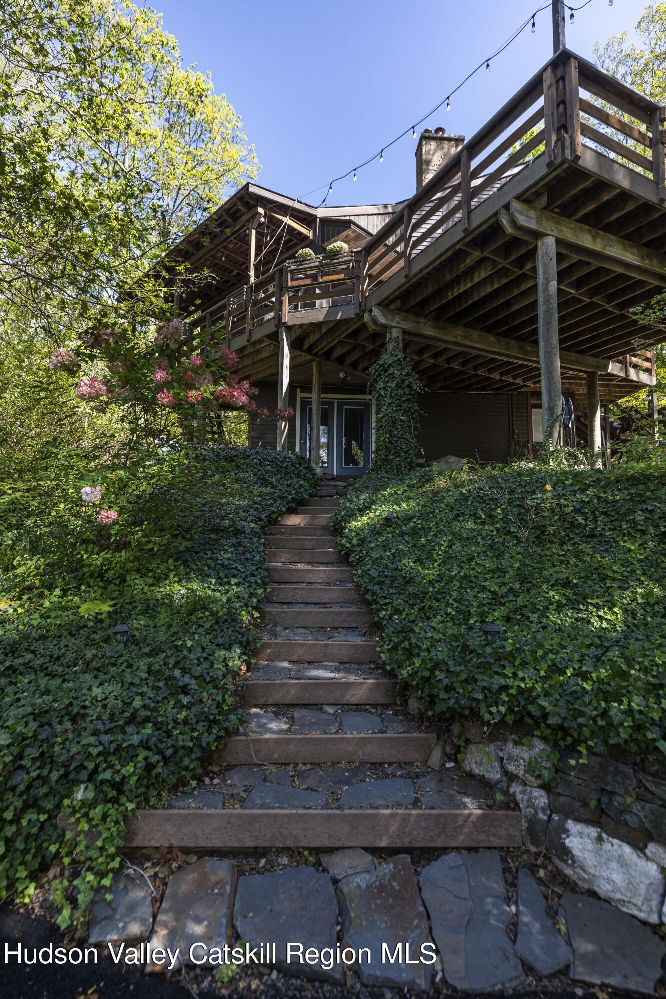 94 Sparkling Ridge Road New Paltz, NY 12561 - Photo 31 of 35 a view of a house with a small yard and plants