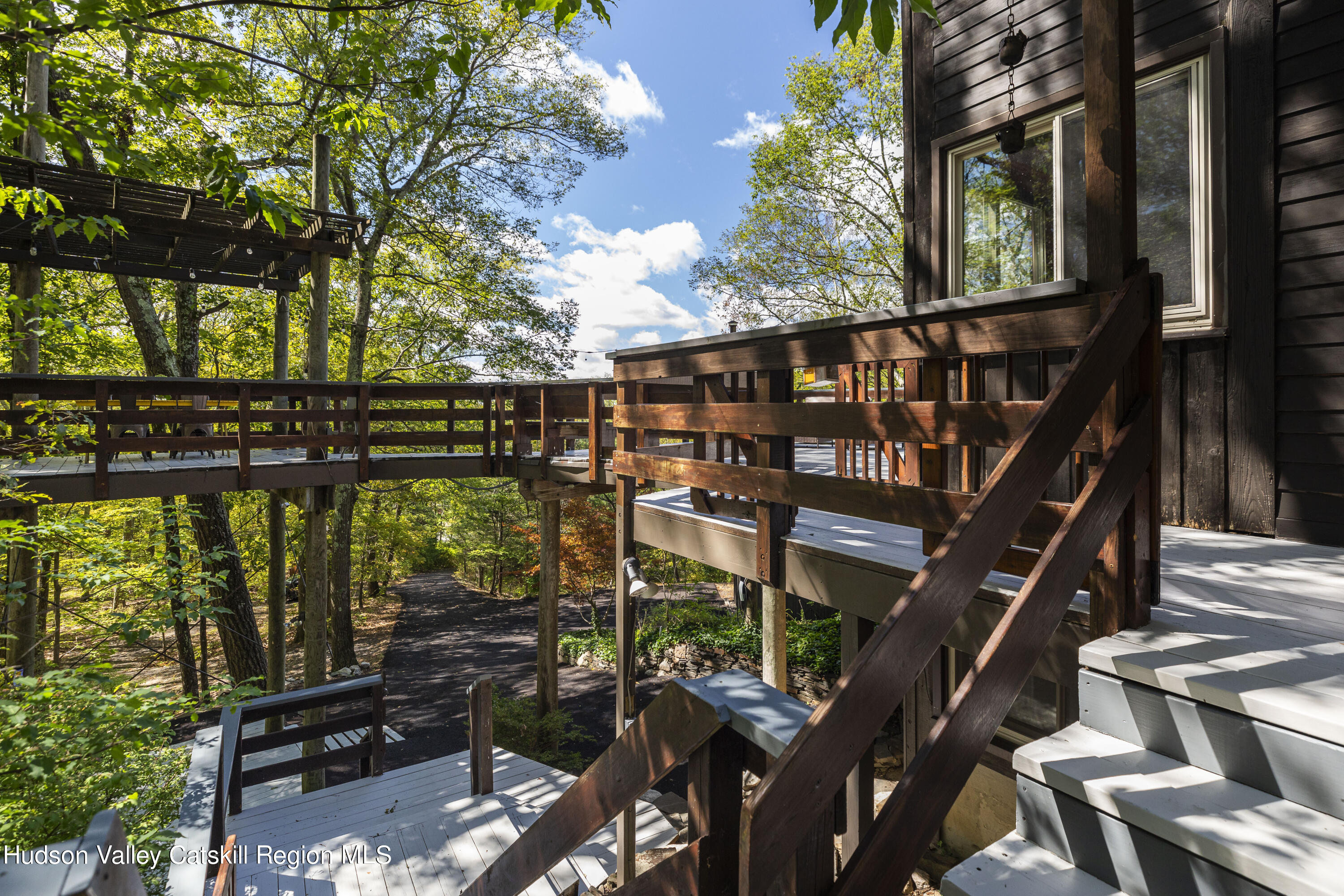 94 Sparkling Ridge Road New Paltz, NY 12561 - Photo 5 of 35 a view of an chairs and floor with wooden fence