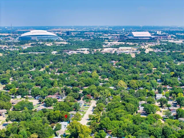 an aerial view of a house with yard garage and outdoor seating