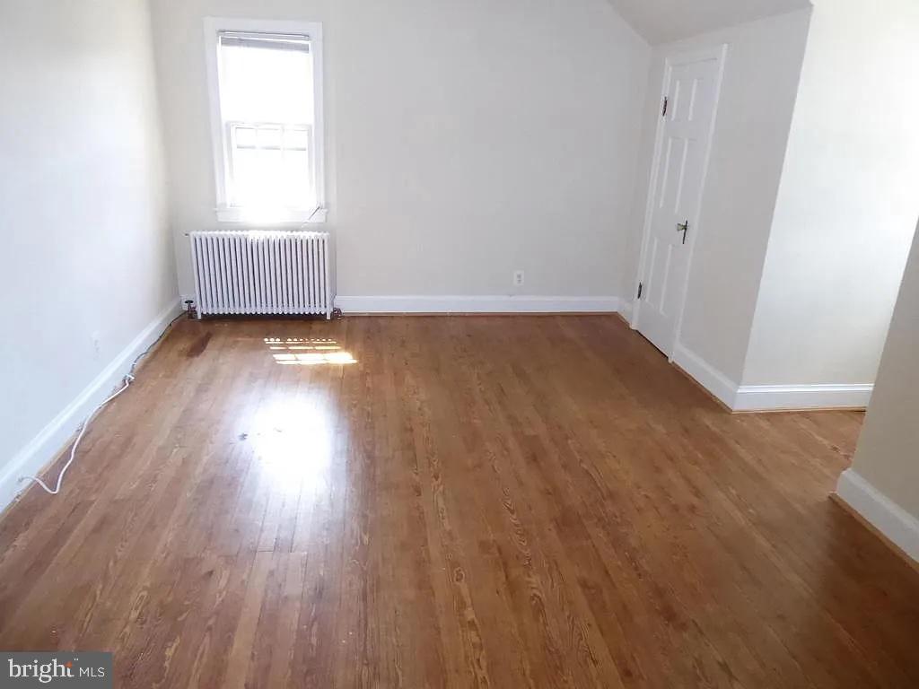 4344 Ellicott Street Northwest Washington, DC 20016 - Photo 11 of 25 a view of an empty room and wooden floor