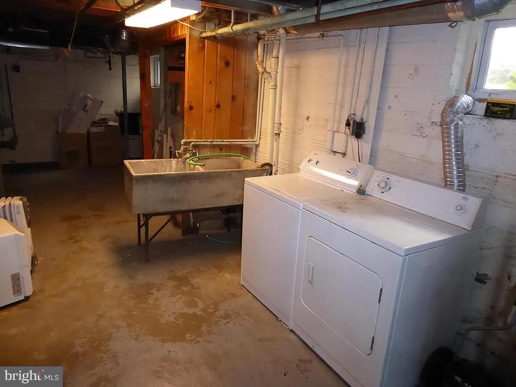 4344 Ellicott Street Northwest Washington, DC 20016 - Photo 22 of 25 a bathroom with a sink and a mirror