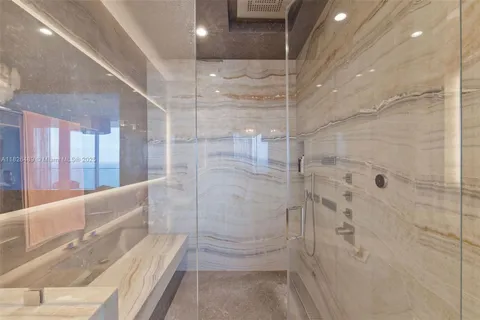 a view of bathroom with a sink toilet and shower