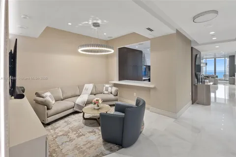 a view of a swimming pool with a garden and palm trees