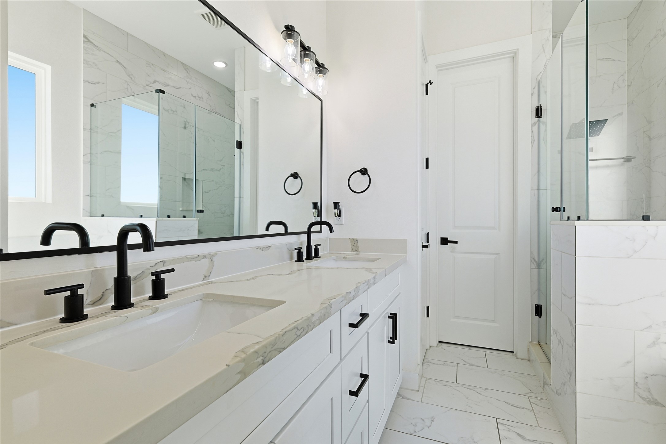 107 West Whitney Street, Unit C Houston, TX 77018 - Photo 14 of 27 a bathroom with a double vanity sink a mirror and a shower