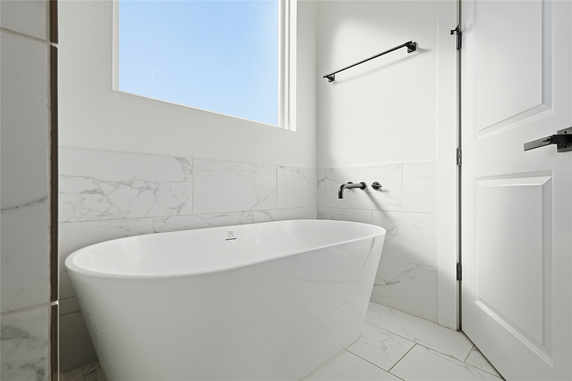 107 West Whitney Street, Unit C Houston, TX 77018 - Photo 15 of 27 a white bath tub sitting in a bathroom