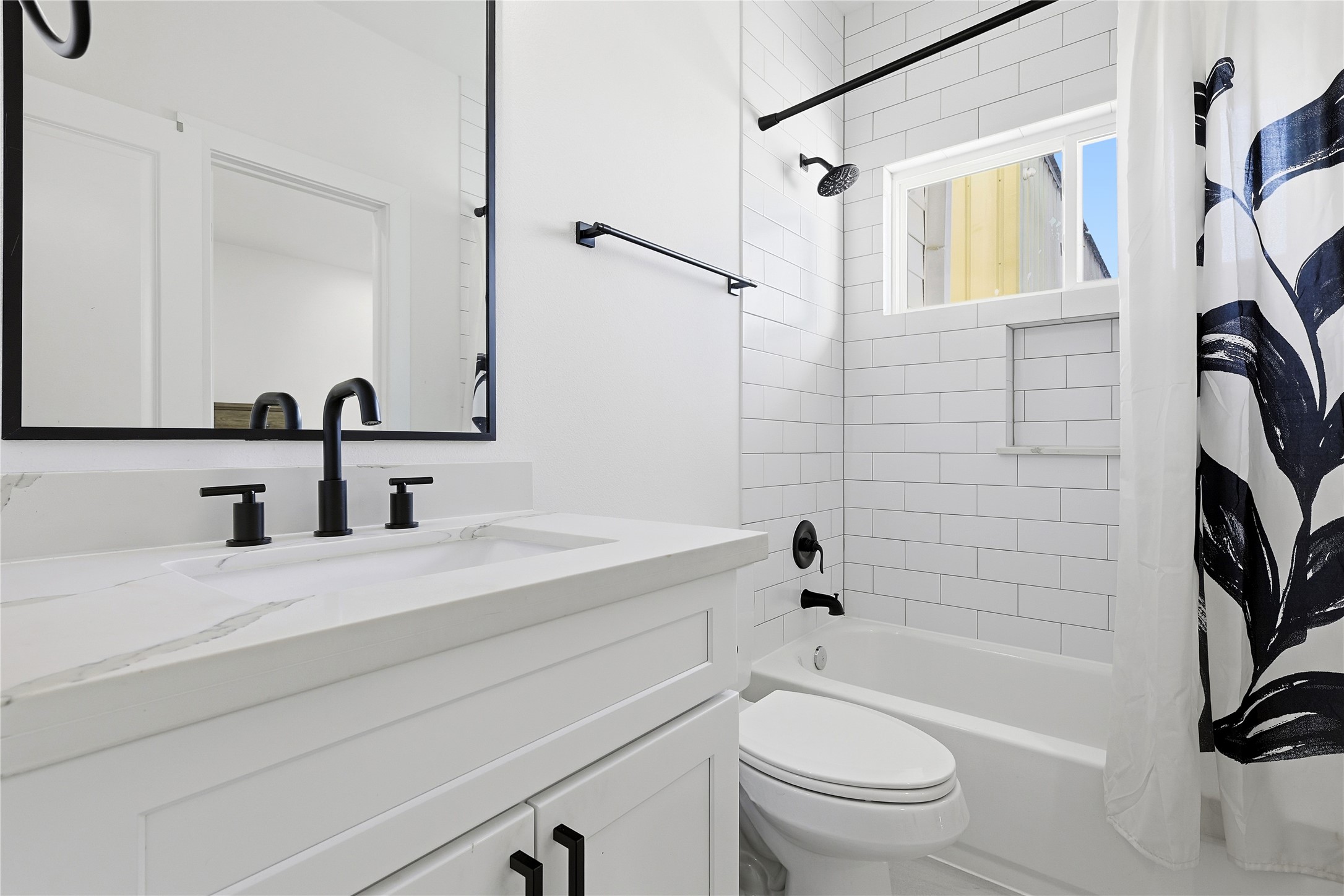 107 West Whitney Street, Unit C Houston, TX 77018 - Photo 20 of 27 a bathroom with a sink a toilet and a mirror