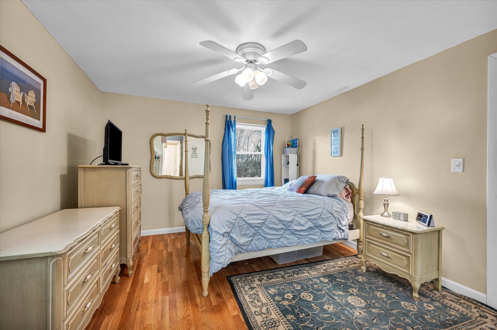 491 Long Hill Road Middletown, CT 06457 - Photo 12 of 27 a bed room with a bed mirror and a window