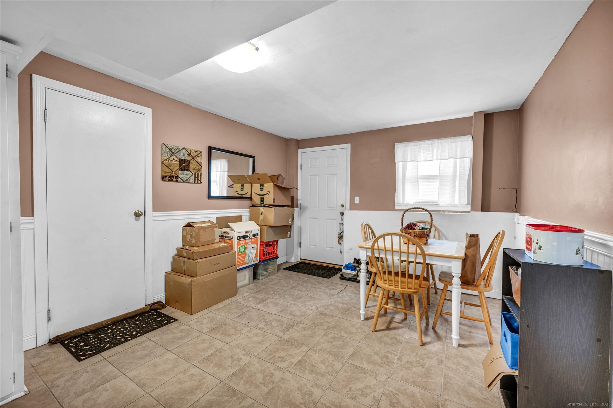 491 Long Hill Road Middletown, CT 06457 - Photo 22 of 27 a living room with furniture a window and a table