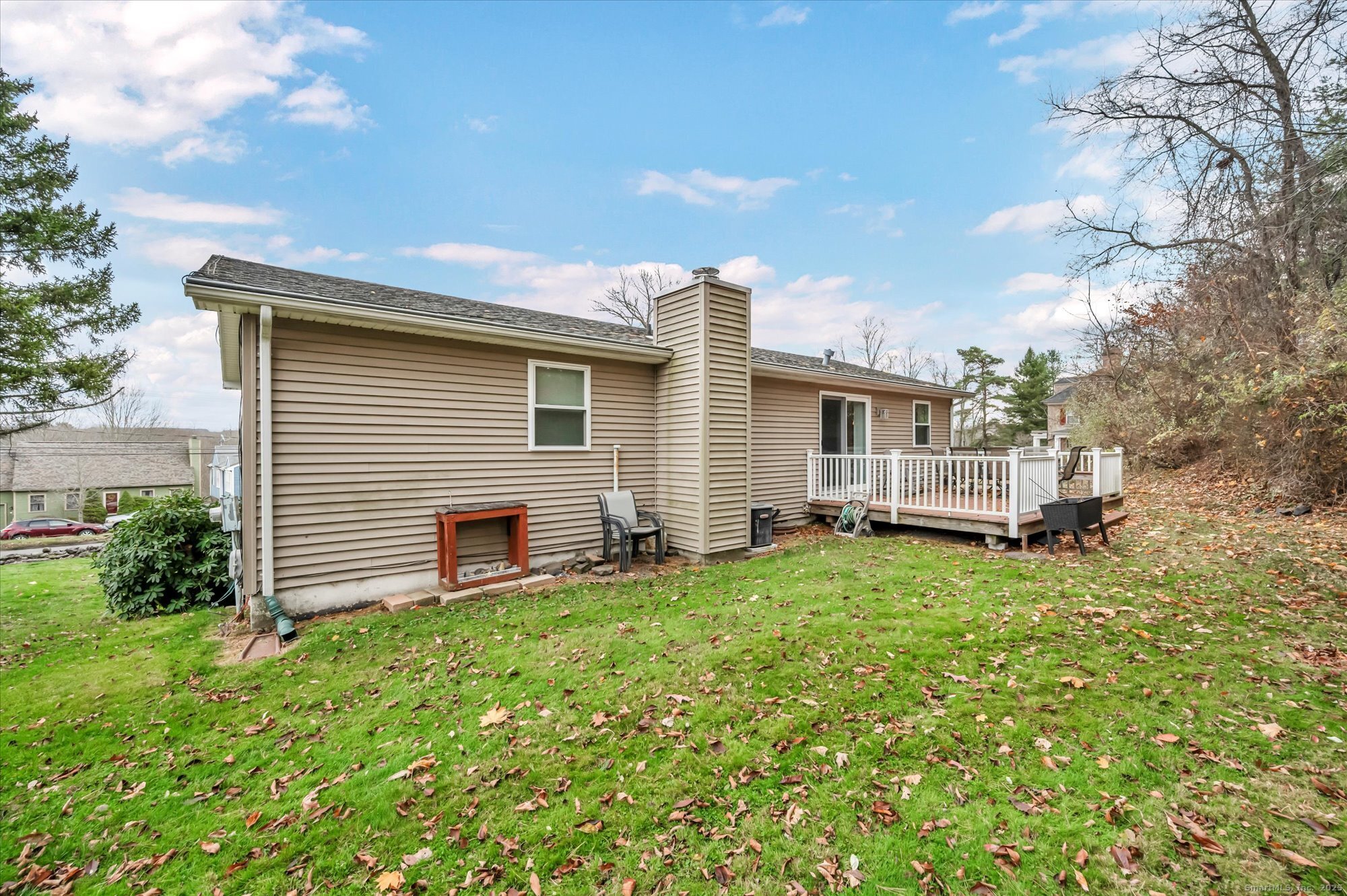 491 Long Hill Road Middletown, CT 06457 - Photo 26 of 27 a backyard of a house with table and chairs
