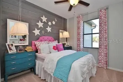 a bedroom with a bed dresser and a window