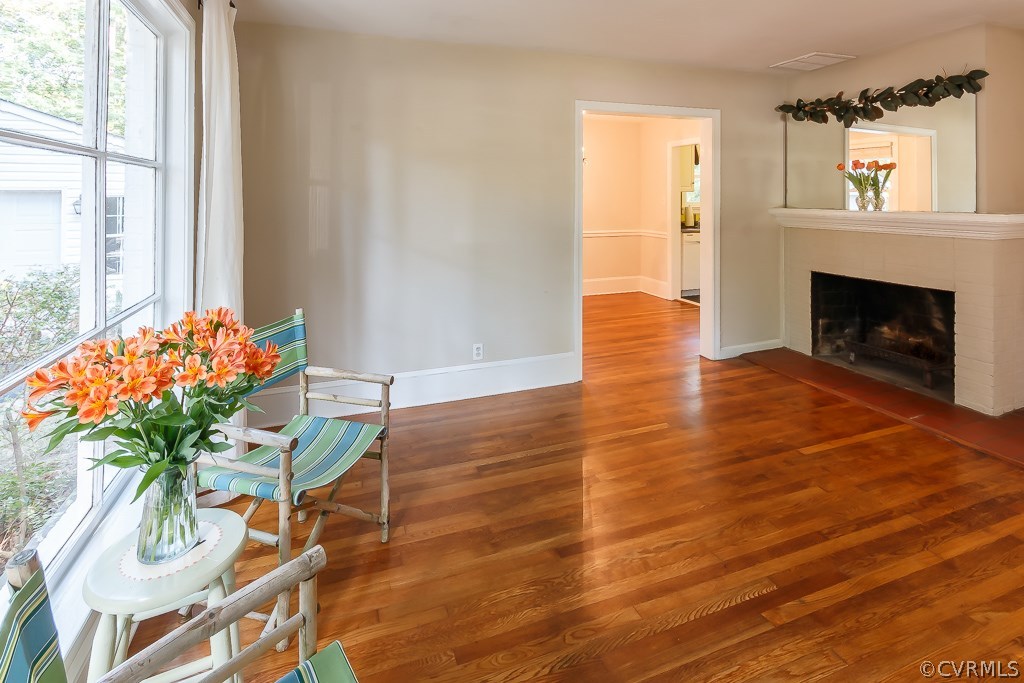 Family room with wood burning fireplace.