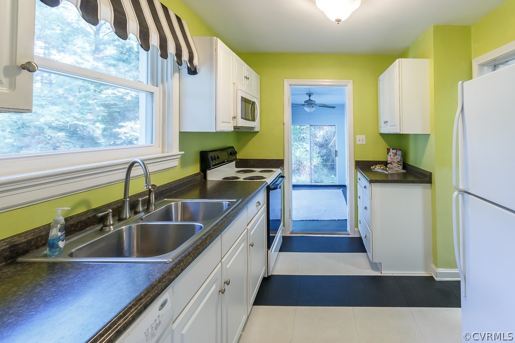 White appliances and lots of storage.