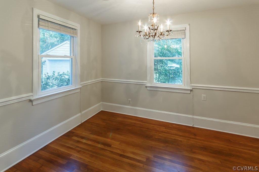 Formal dining room with chair rail and fresh paint