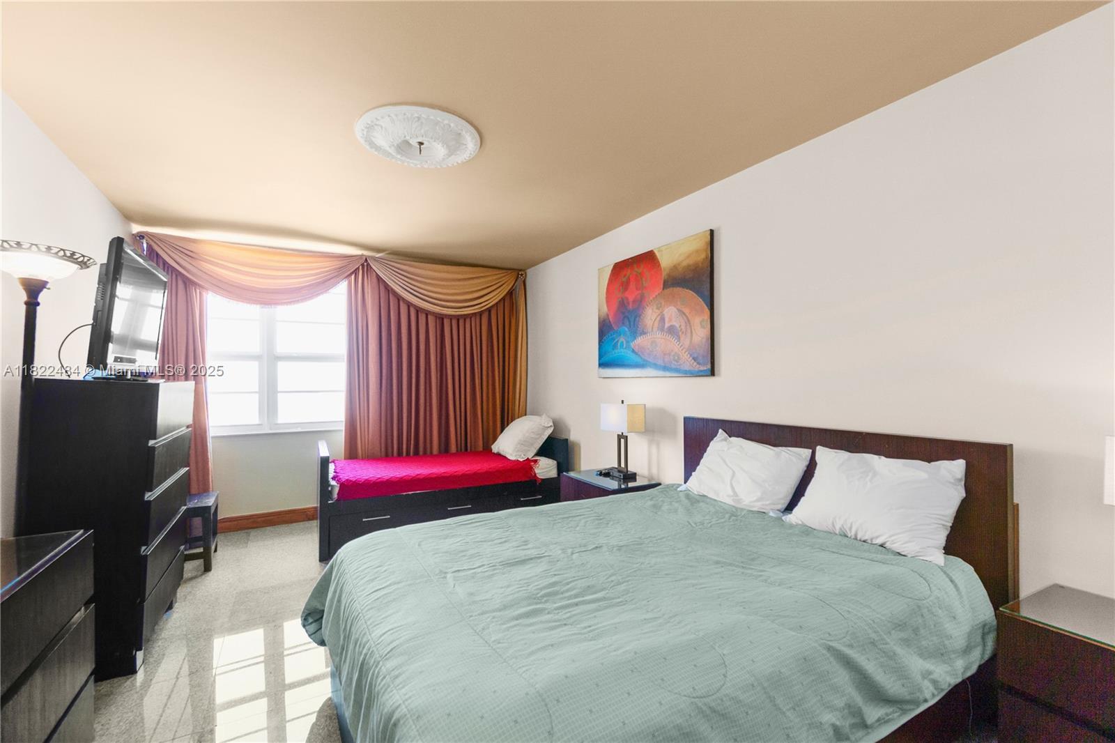 100 Lincoln Road, Unit 811 Miami Beach, FL 33139 - Photo 19 of 36 a bedroom with a bed and a flat screen tv