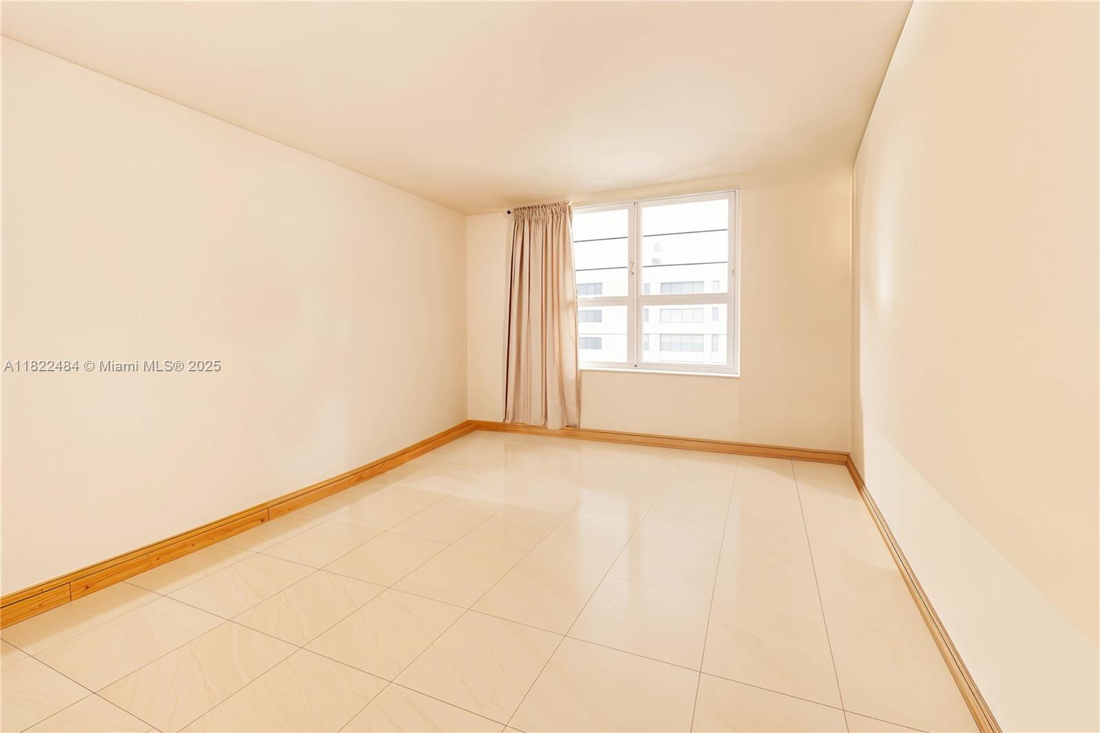 100 Lincoln Road, Unit 811 Miami Beach, FL 33139 - Photo 24 of 36 an empty room with windows
