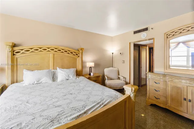 a bedroom with a bed and a cabinets