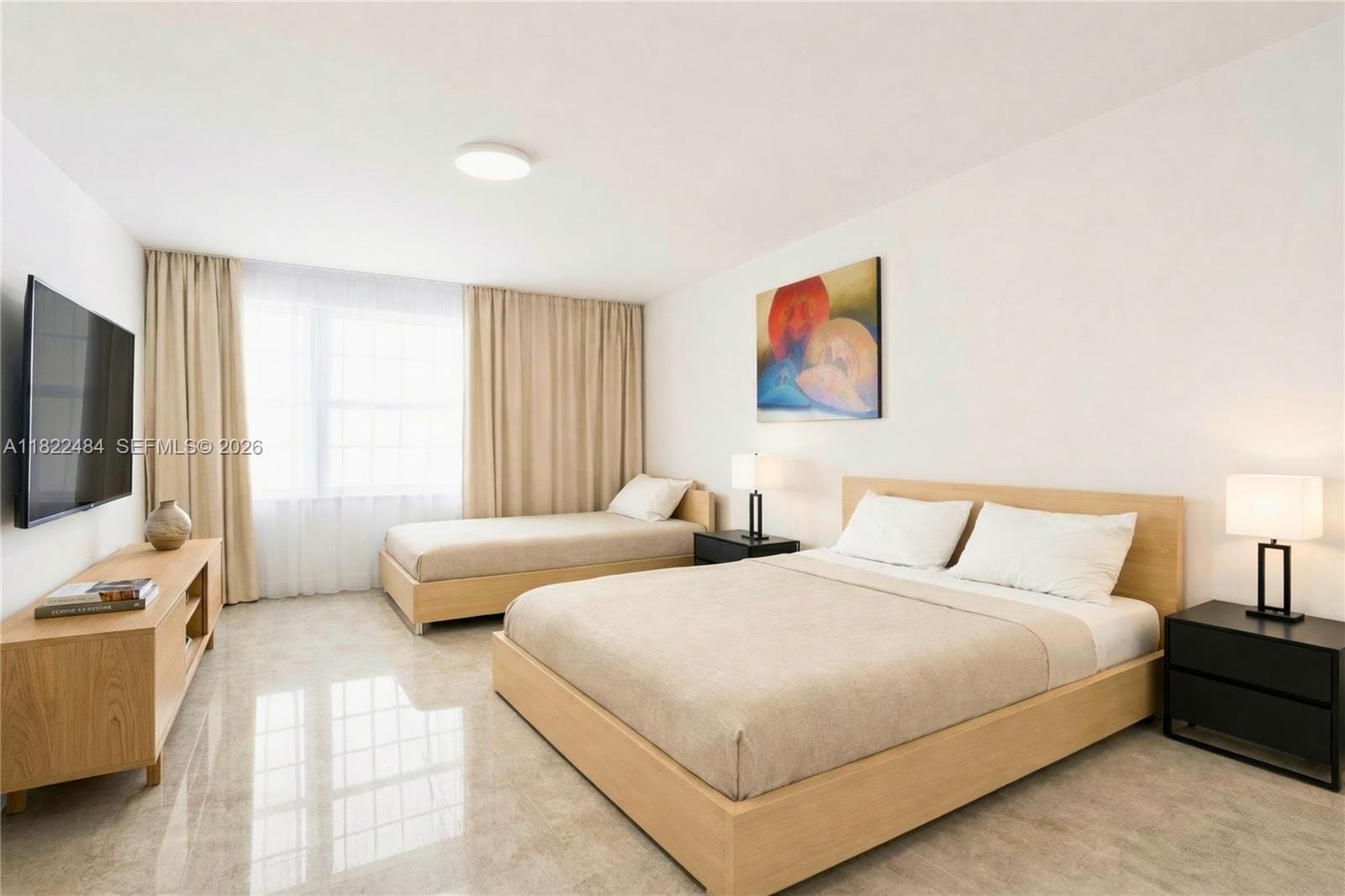 100 Lincoln Road, Unit 811 Miami Beach, FL 33139 - Photo 8 of 29 a bedroom with two beds and a couch