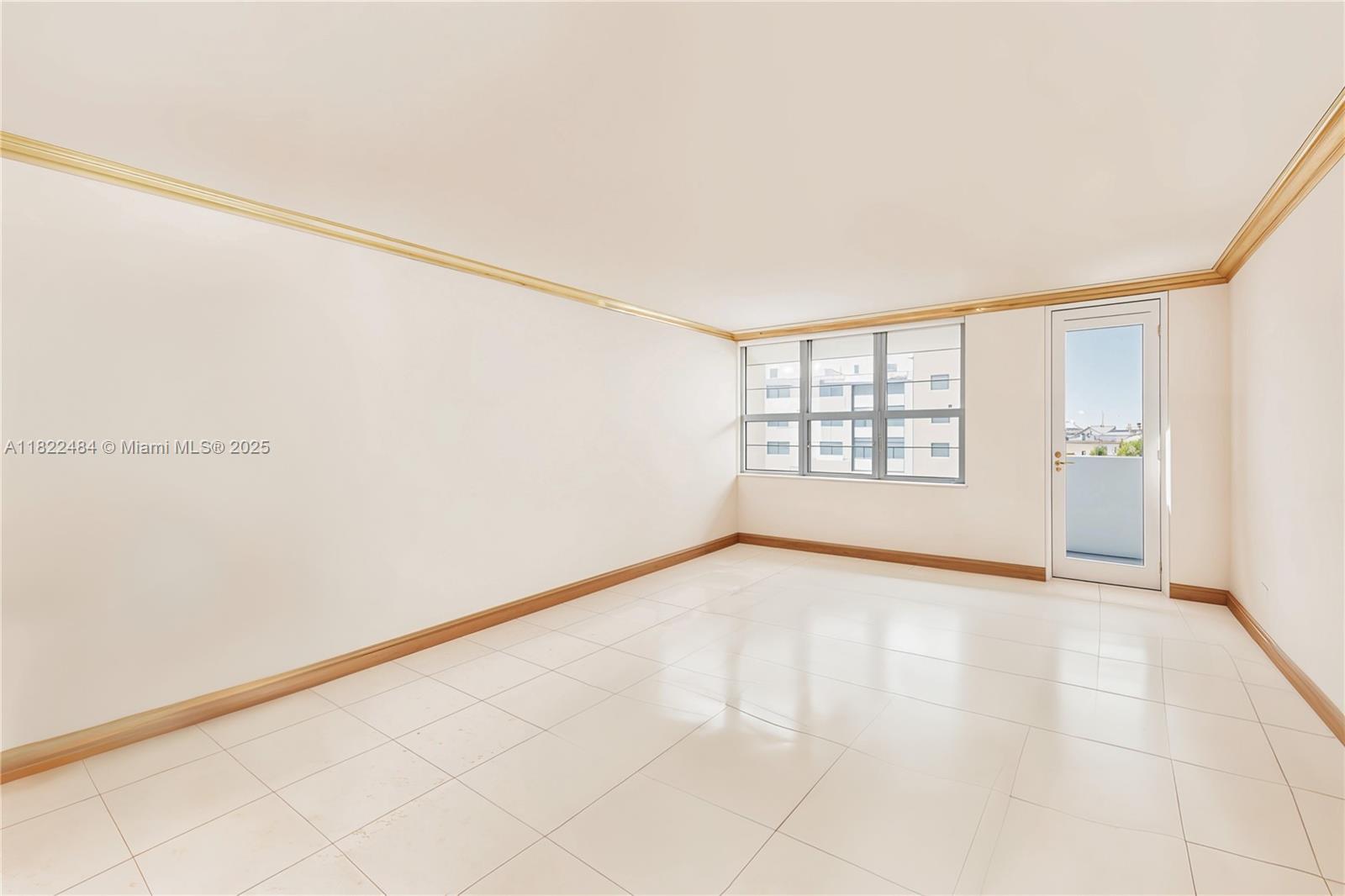 100 Lincoln Road, Unit 811 Miami Beach, FL 33139 - Photo 10 of 36 an empty room with windows