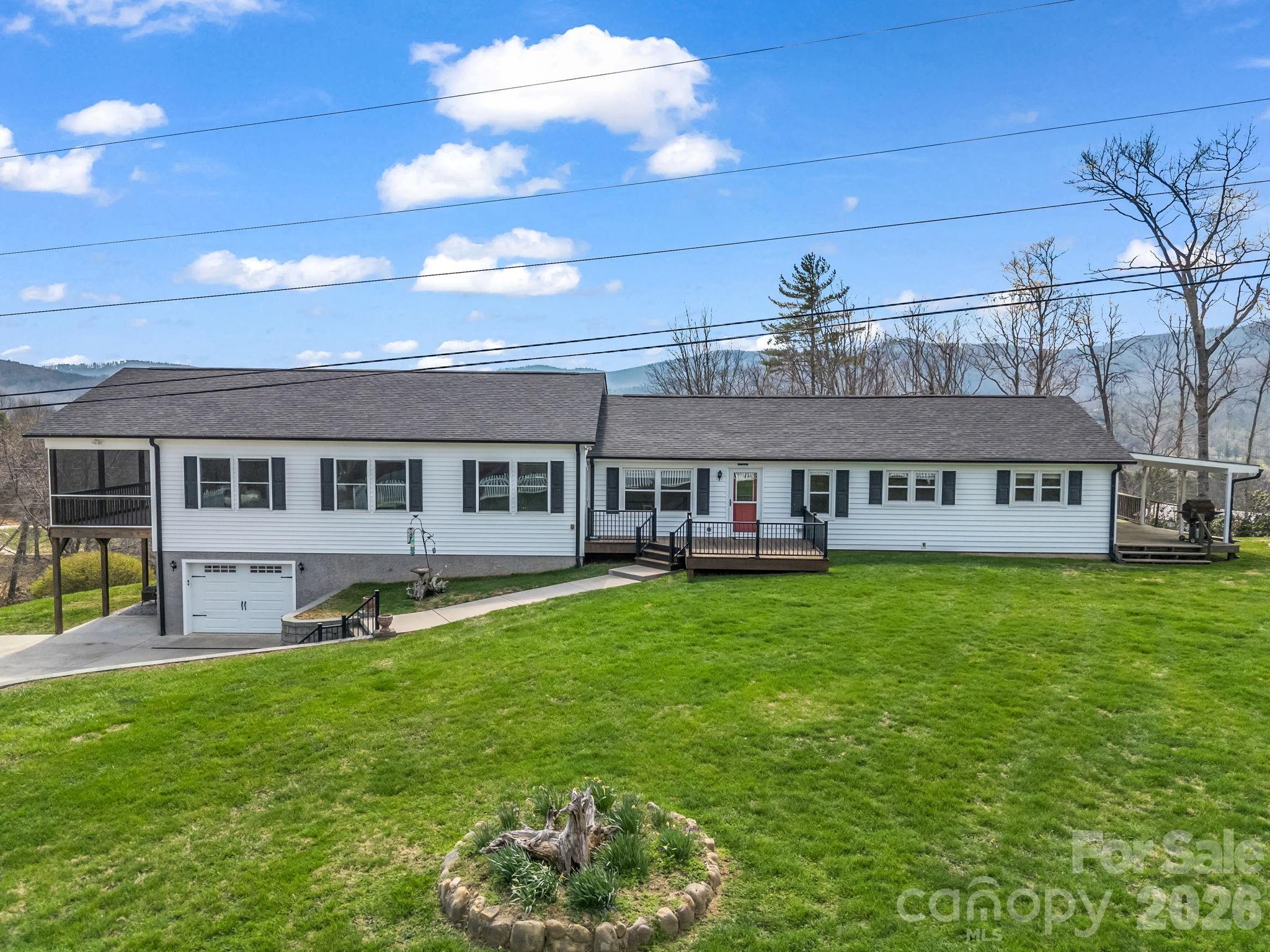 a view of a house with a backyard