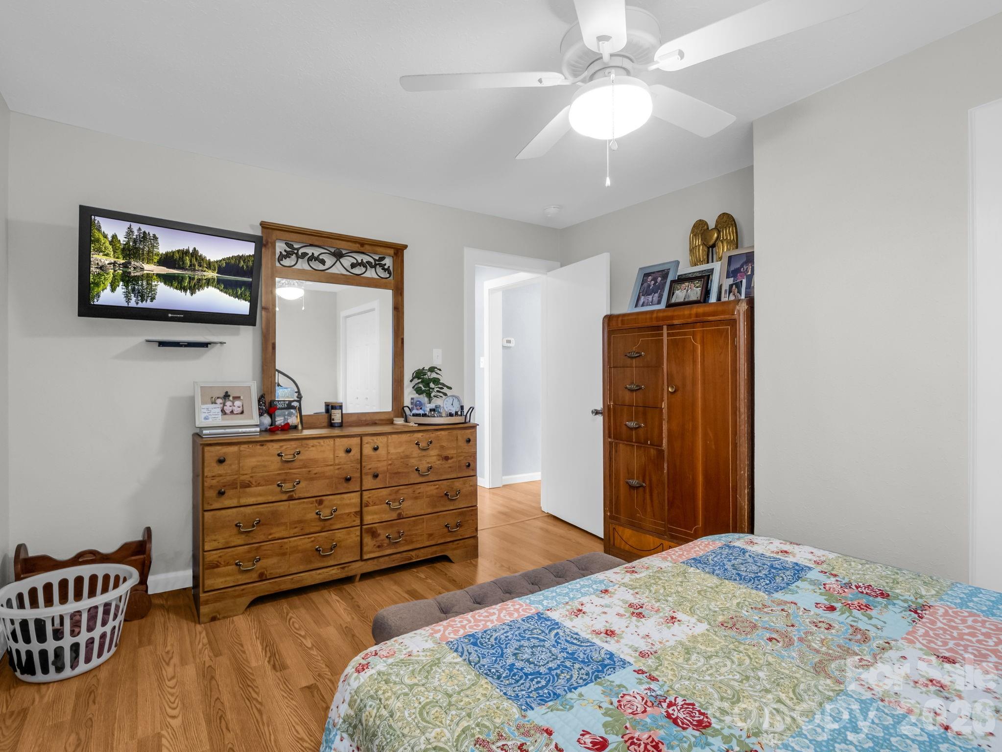 1086 Carters Ridge Road Spruce Pine, NC 28777 - Photo 13 of 48 a bedroom with a bed and a dresser in it