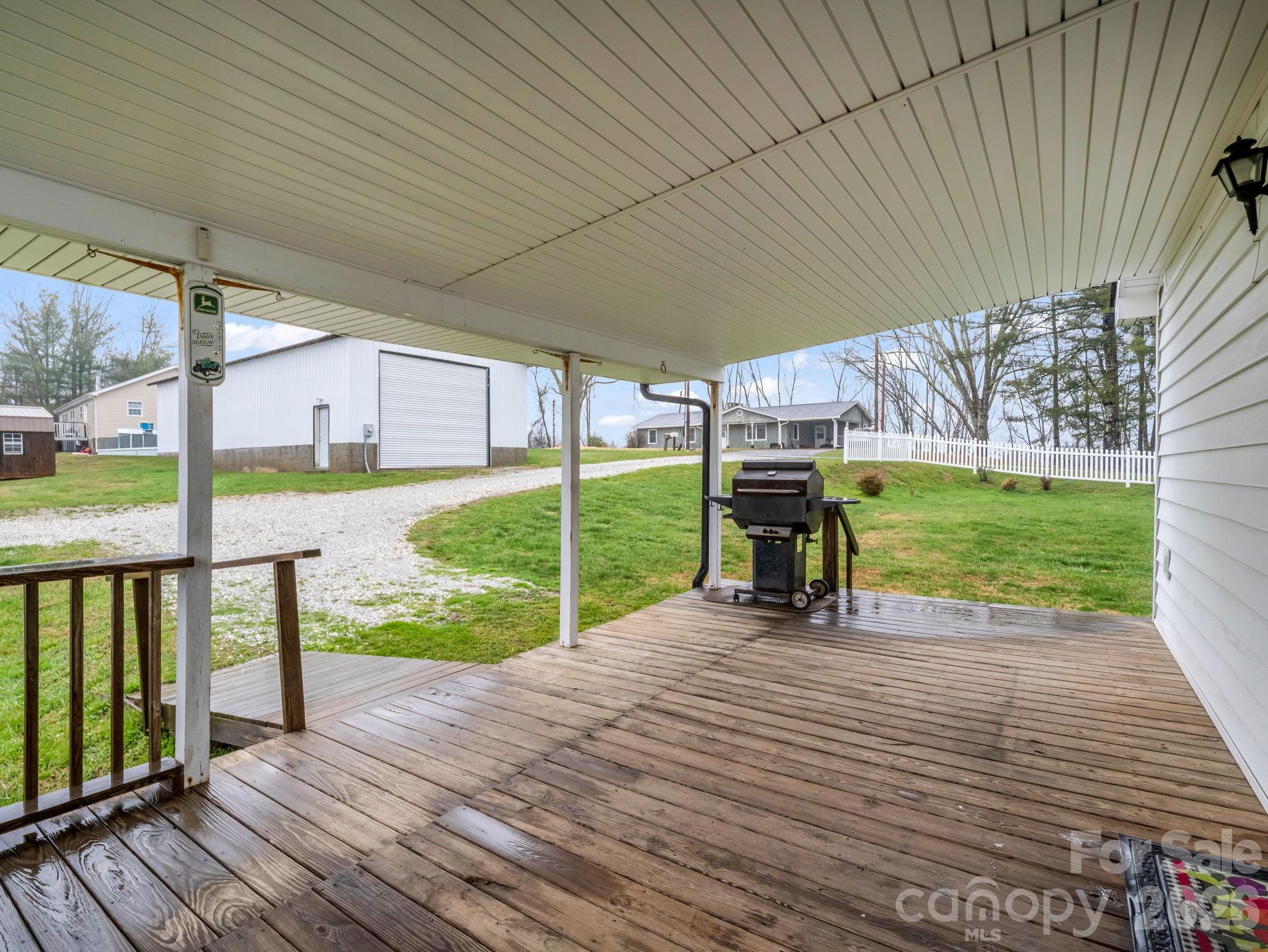 1086 Carters Ridge Road Spruce Pine, NC 28777 - Photo 45 of 48 a view of a deck with a big yard